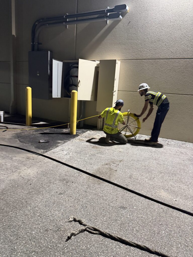 Electricians pulling feeder cable at the IKEA Sarasota service entrance